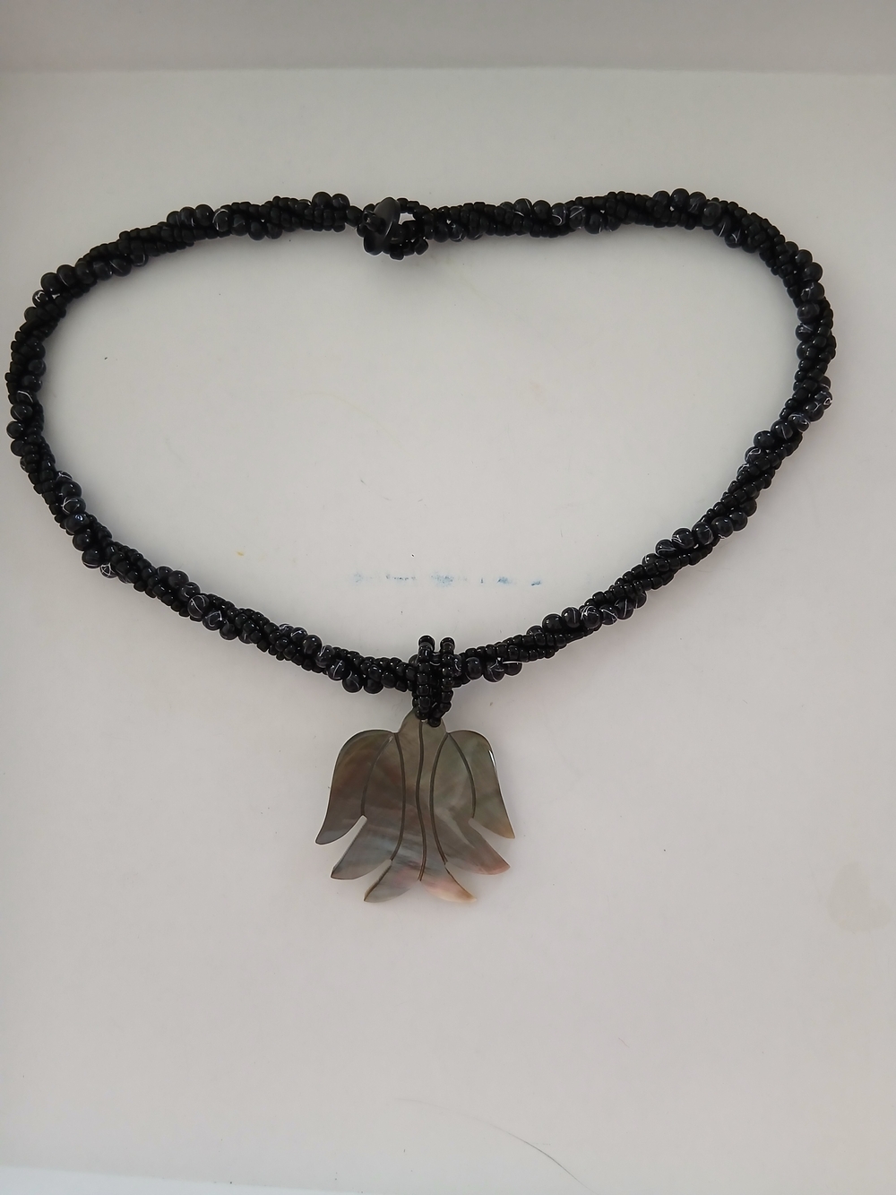 Black Beaded Necklace with Shell Flower Pendant